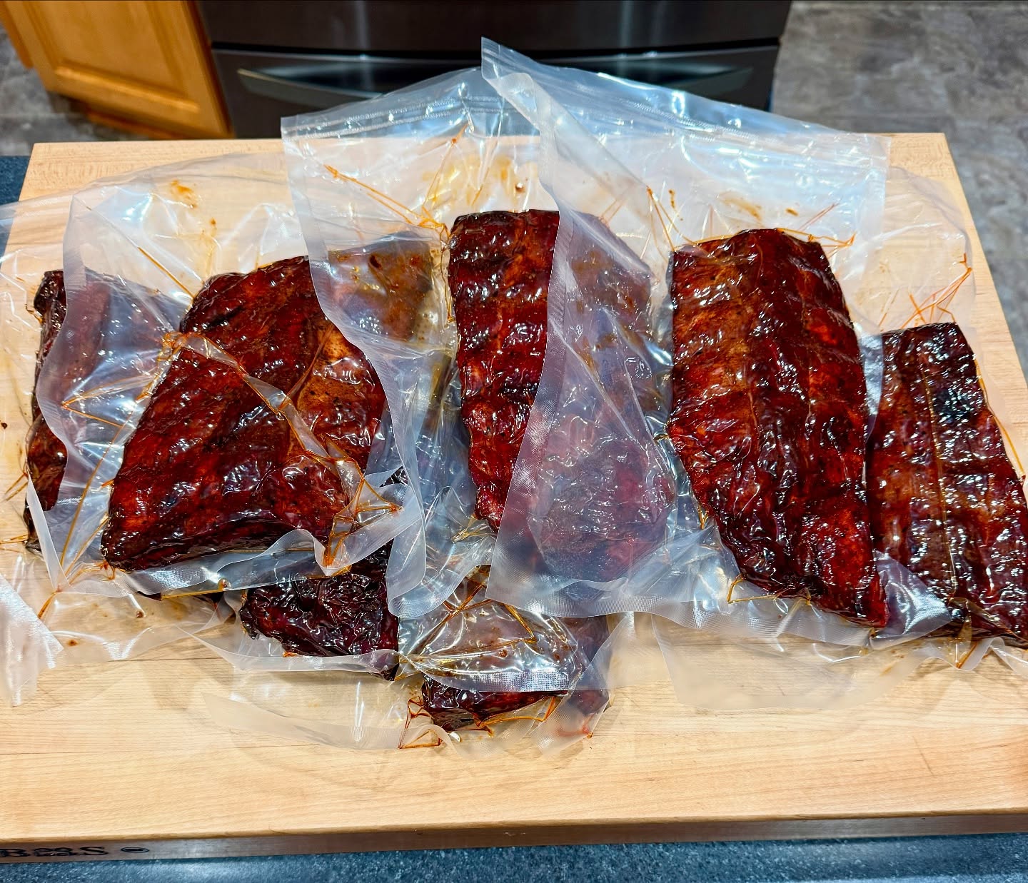 When Mother Nature gives you a 50F day in January, it’s time to bulk smoke some ribs. I’ll vacuum seal them,put them in the freezer and reheat sous vide on demand, sauce them up, and put them under the broiler for 10 minutes. They’ll be fall off the bone tender. 😋